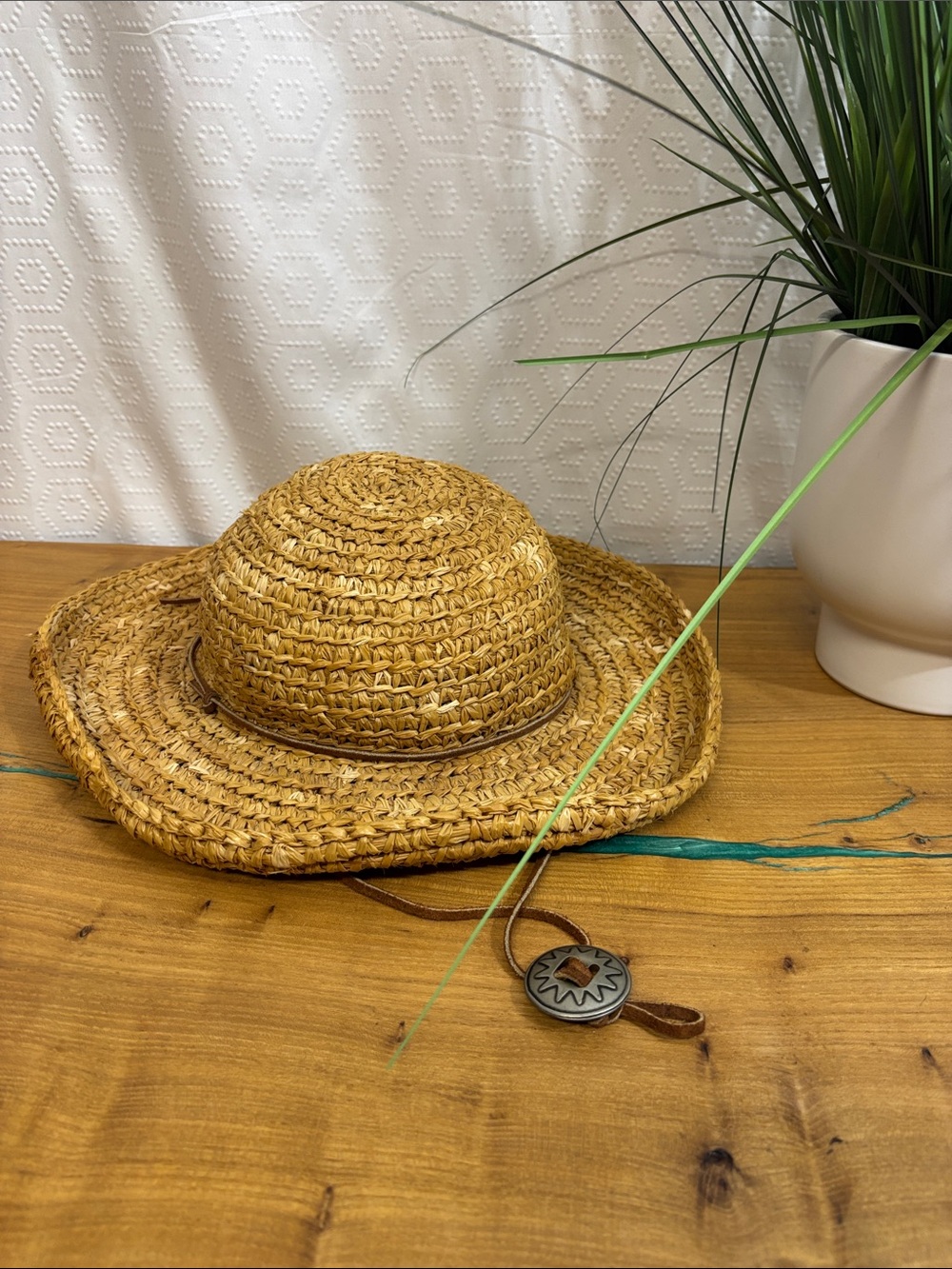 Karen Hartfield straw hat with leather strap and silver buckle accent